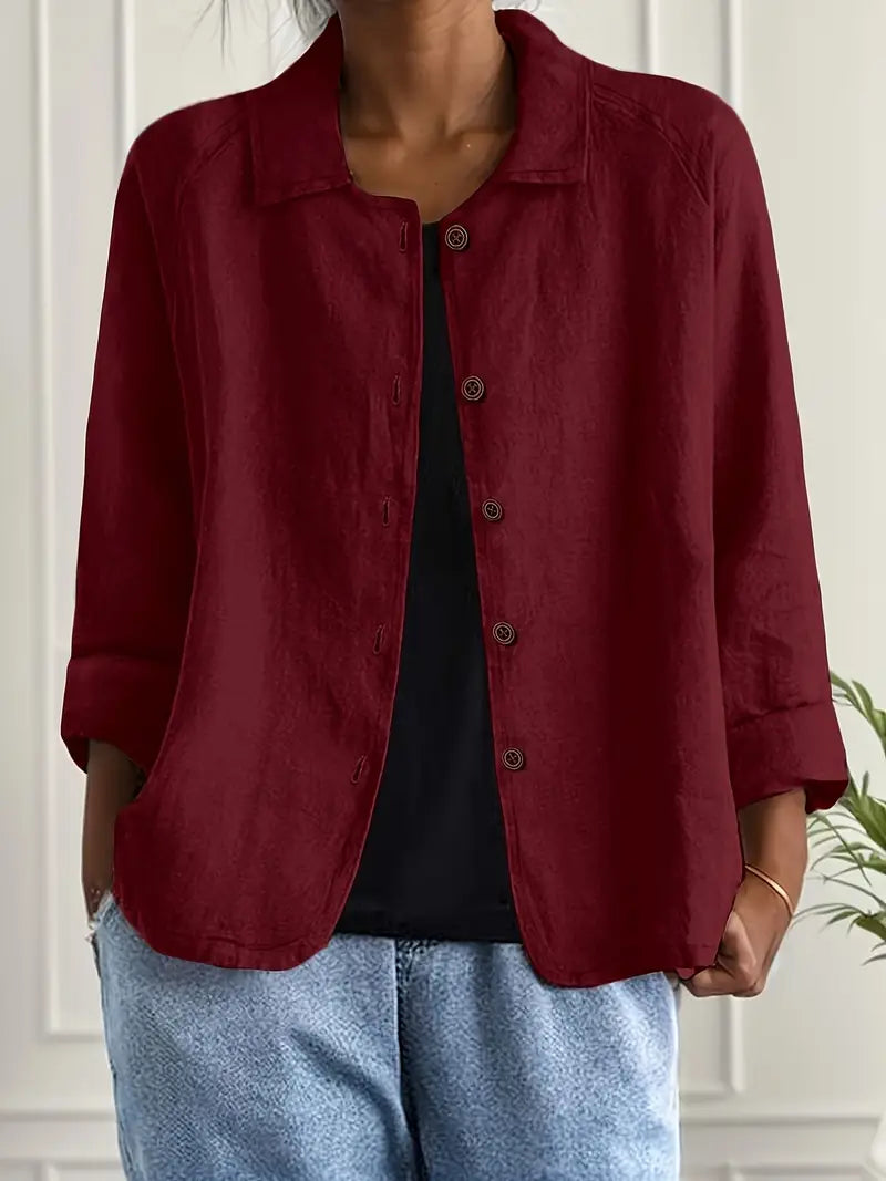 Wine red button-front light top with pointed collar and three-quarter sleeves