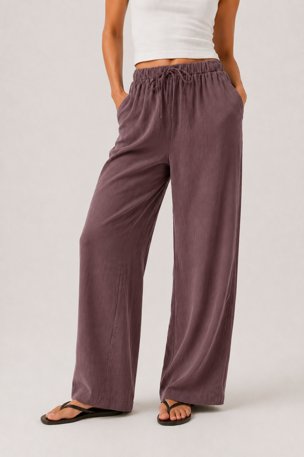 Brennan wide-leg pants in dusty lilac, close-up of elastic waist and wide legs