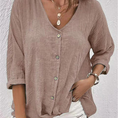 Taupe V-neck button-front top with loose three-quarter sleeves.
