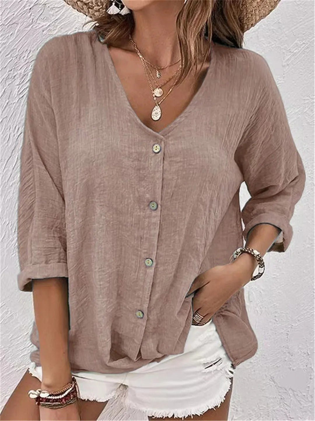 Taupe V-neck button-front top with loose three-quarter sleeves.