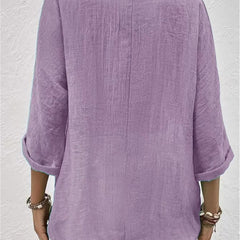 Lavender relaxed top with three-quarter sleeves and a plain back.