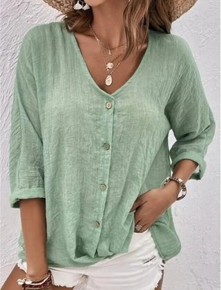 Mint green V-neck button-front top with loose three-quarter sleeves.