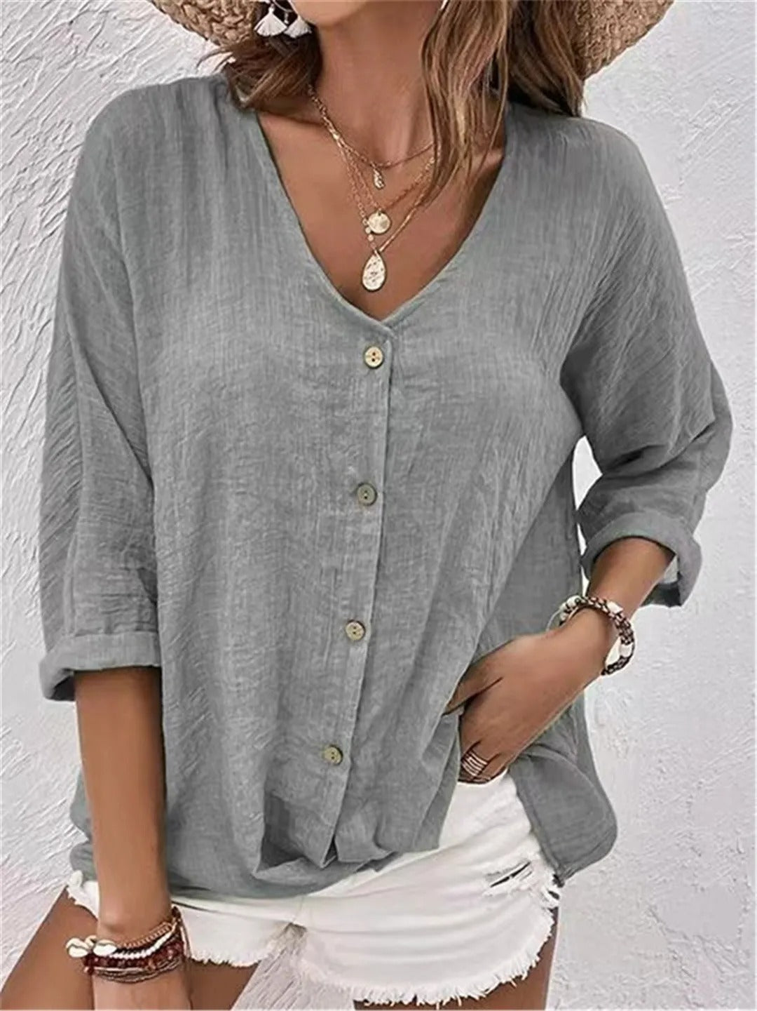 Heather gray V-neck button-front top with loose three-quarter sleeves.