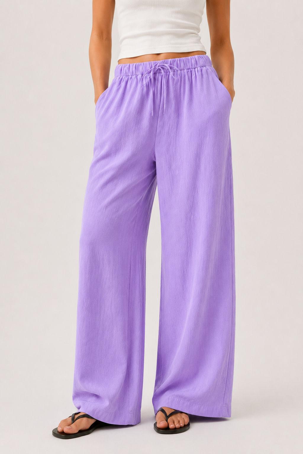 Brennan wide-leg pants in light purple, close-up of elastic waist and full-length legs