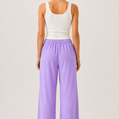 Lavender pants from the back with elastic waist and wide straight legs
