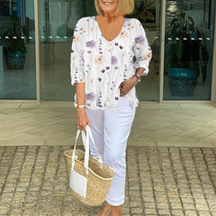 Printed button tunic top in white with floral pattern, three-quarter sleeves