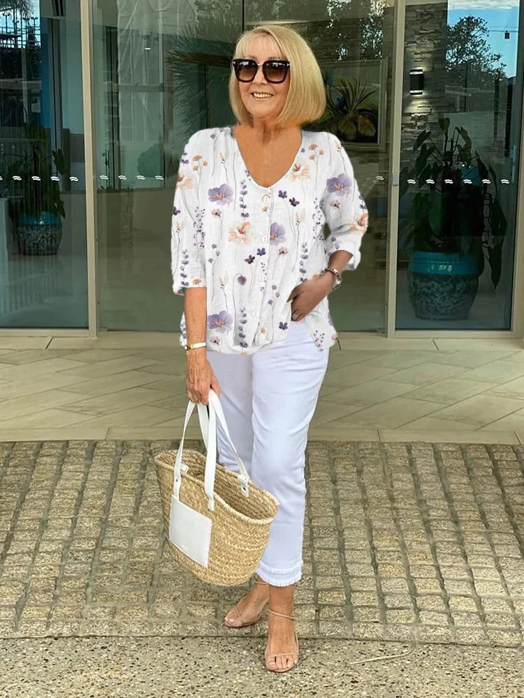 Printed button tunic top in white with floral pattern, three-quarter sleeves
