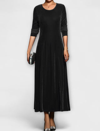 Black soft velvet dress with long sleeves, round neck, fitted bodice and midi skirt