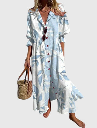 Light blue bohemian dress with botanical print, button-front V-neck, short sleeves