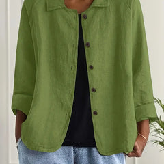 Green button-front light top with pointed collar and three-quarter sleeves