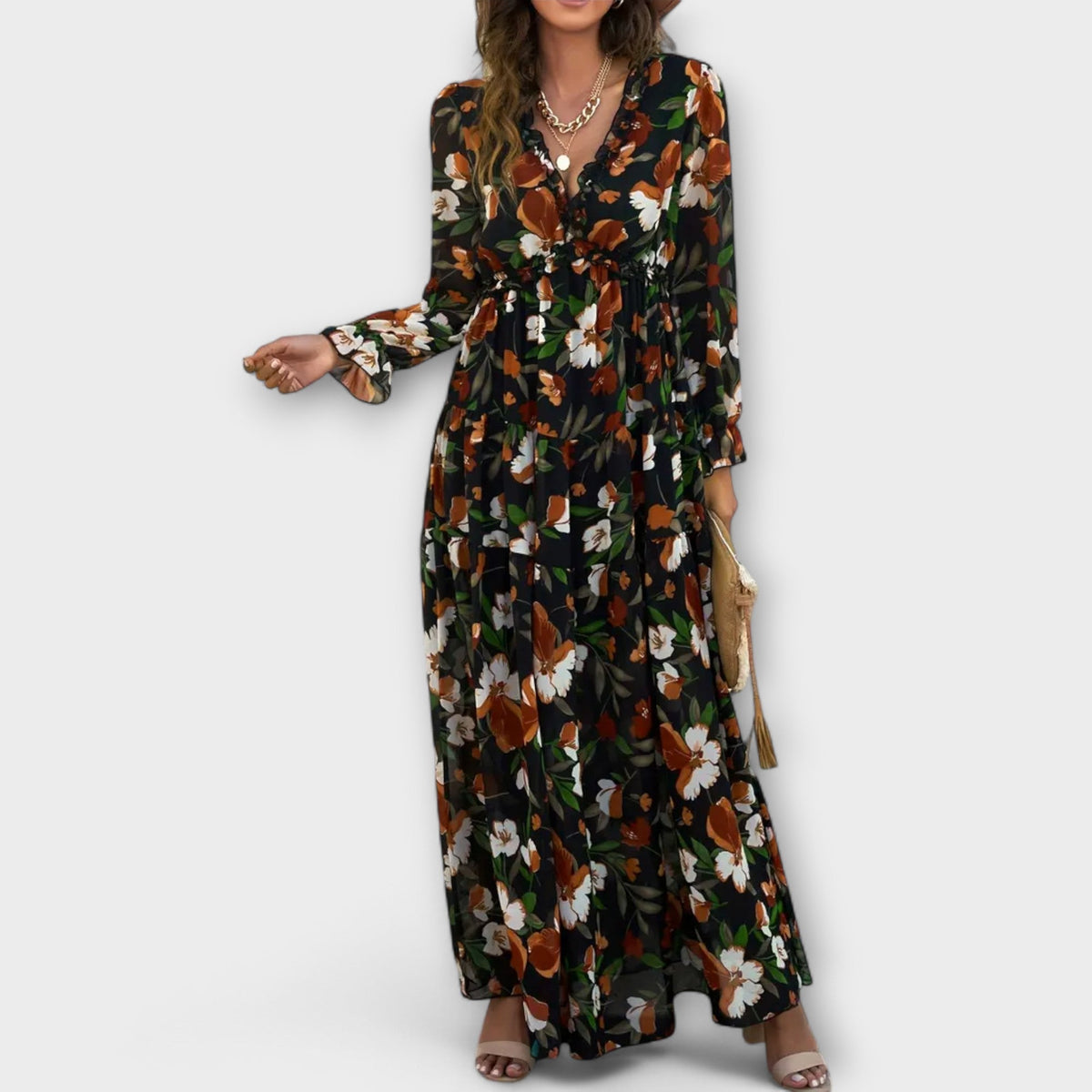 Black floral maxi dress with V-neck, long sleeves, and tiered skirt