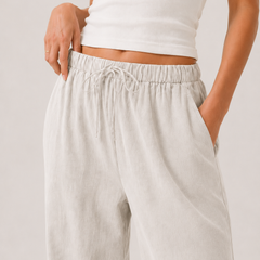 Brennan pants light off-white with elastic drawstring waist and relaxed wide silhouette
