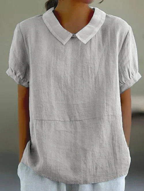 Light gray short-sleeve collared shirt with V-neck and front seam