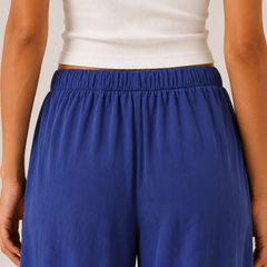Brennan pants in cobalt blue, close-up elastic waistband and gathered fabric