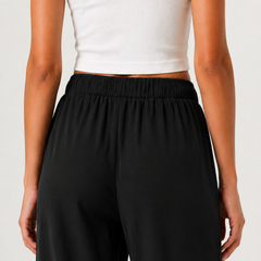 Brennan wide-leg pants in black, elastic waist and relaxed straight legs