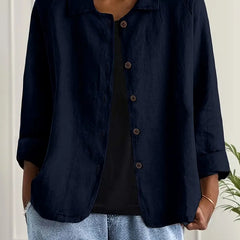 Navy button-front light top with pointed collar and three-quarter sleeves