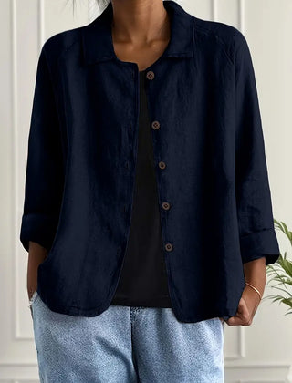 Navy button-front light top with pointed collar and three-quarter sleeves