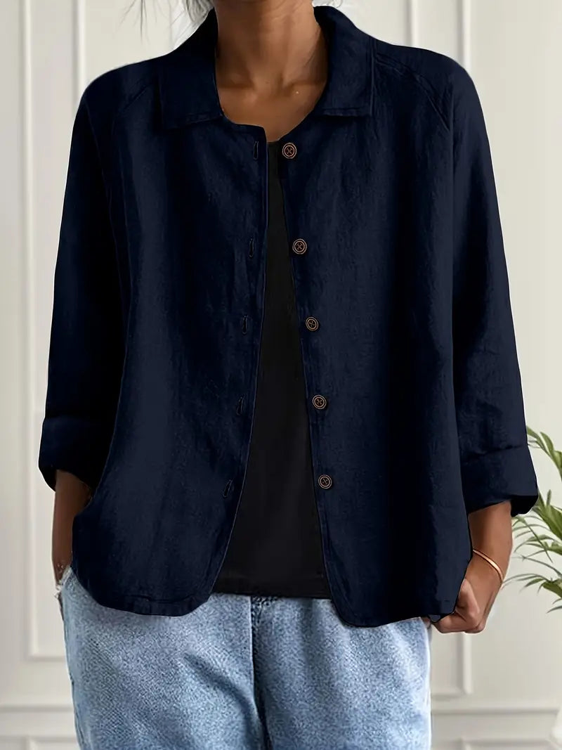 Navy button-front light top with pointed collar and three-quarter sleeves
