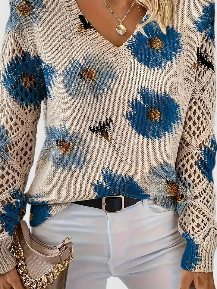 Close-up cream knit cardigan with blue floral and bird print, V-neck and lace sleeves