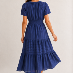 Royal blue tiered V-neck midi dress back view with gathered waist and short sleeves