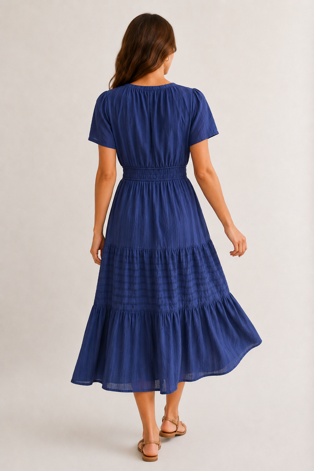 Royal blue tiered V-neck midi dress back view with gathered waist and short sleeves