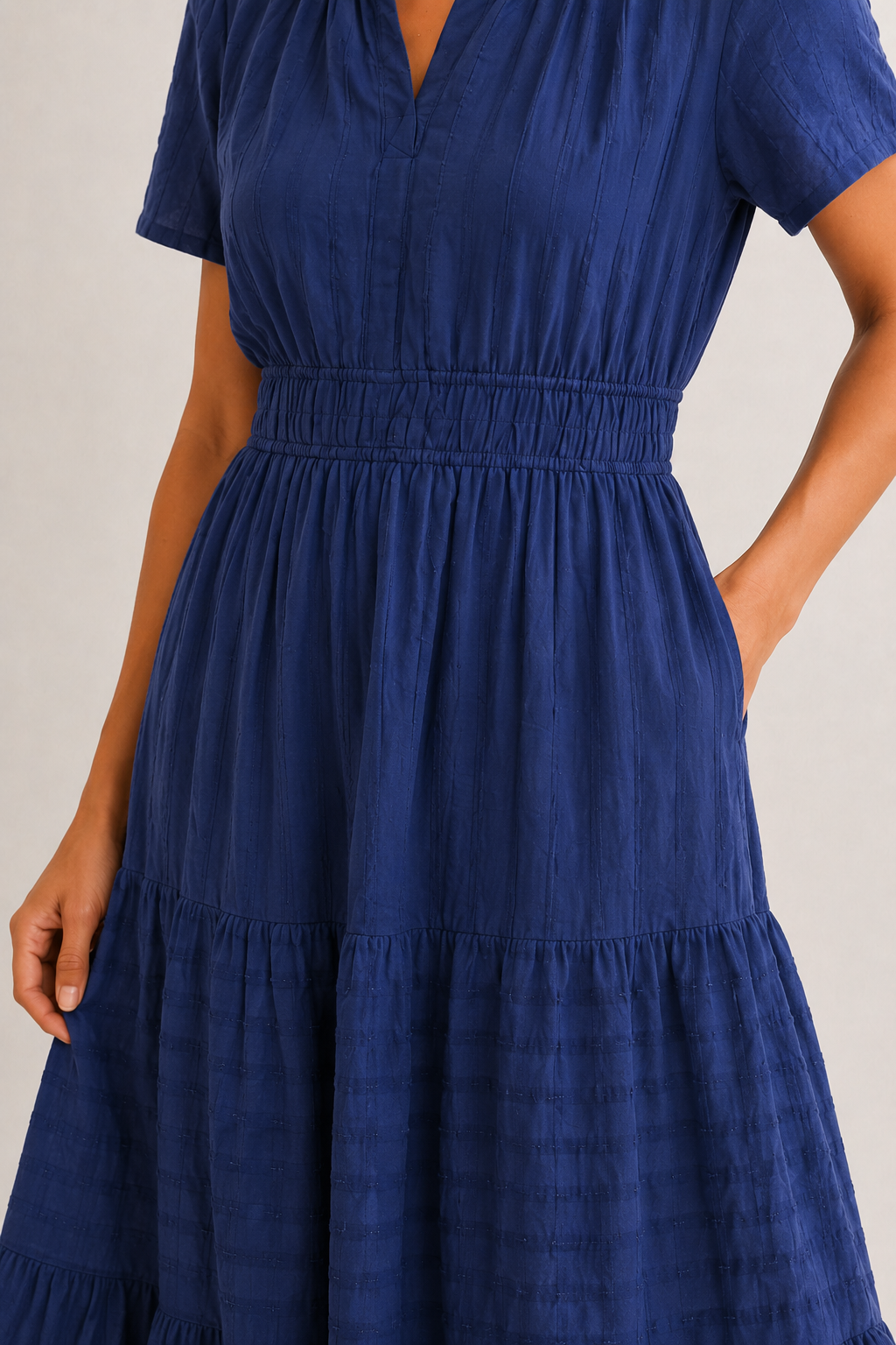 Royal blue tiered midi dress detail: gathered waist and layered skirt sections