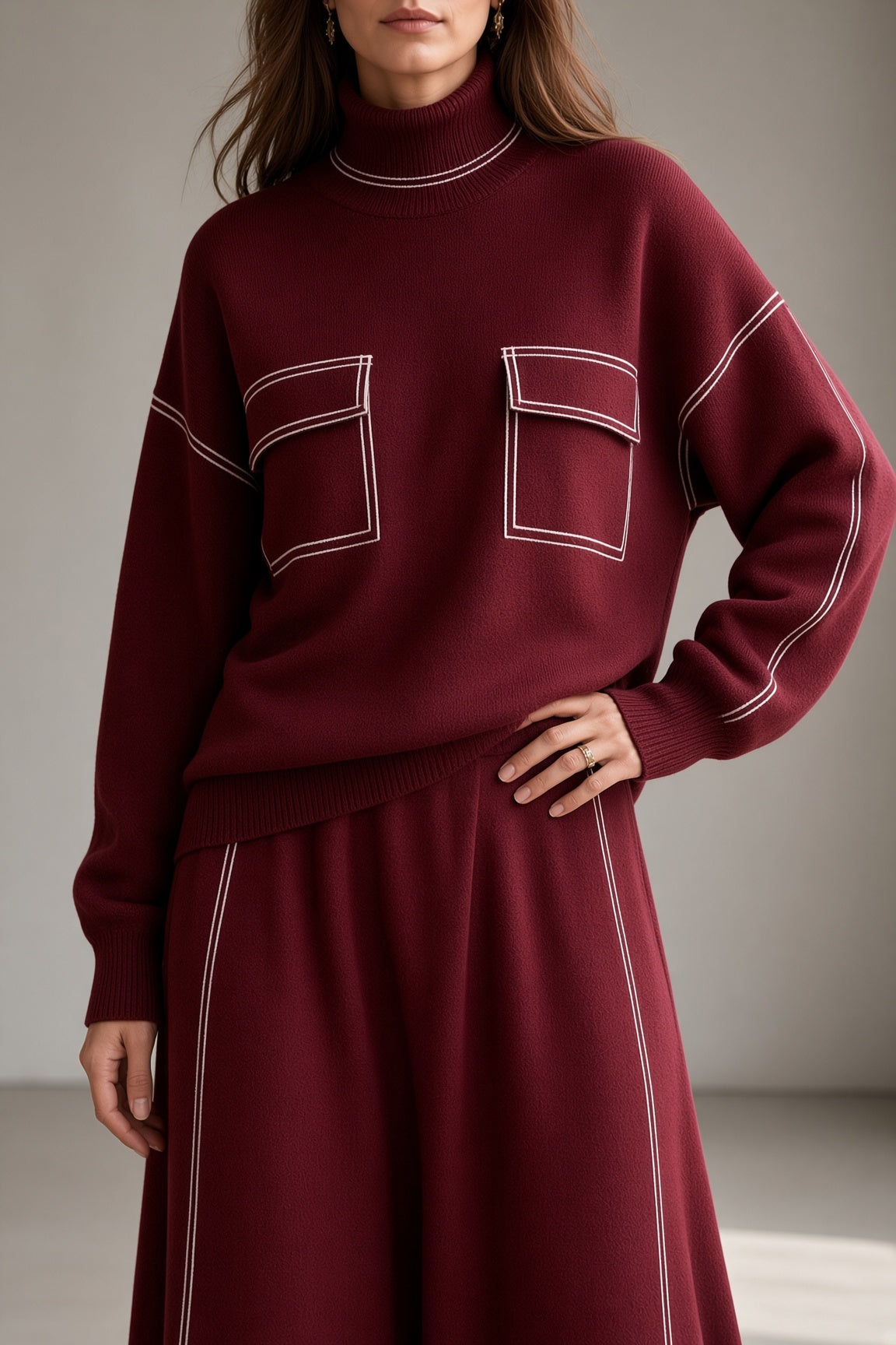 Women's burgundy knit set close-up: mock-neck sweatshirt and matching midi skirt