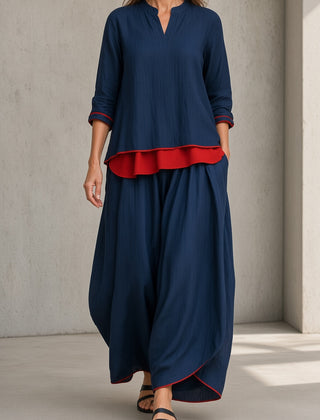 Women's navy blue tunic and wide-leg pants set with red ruffle hem and 3/4 sleeves