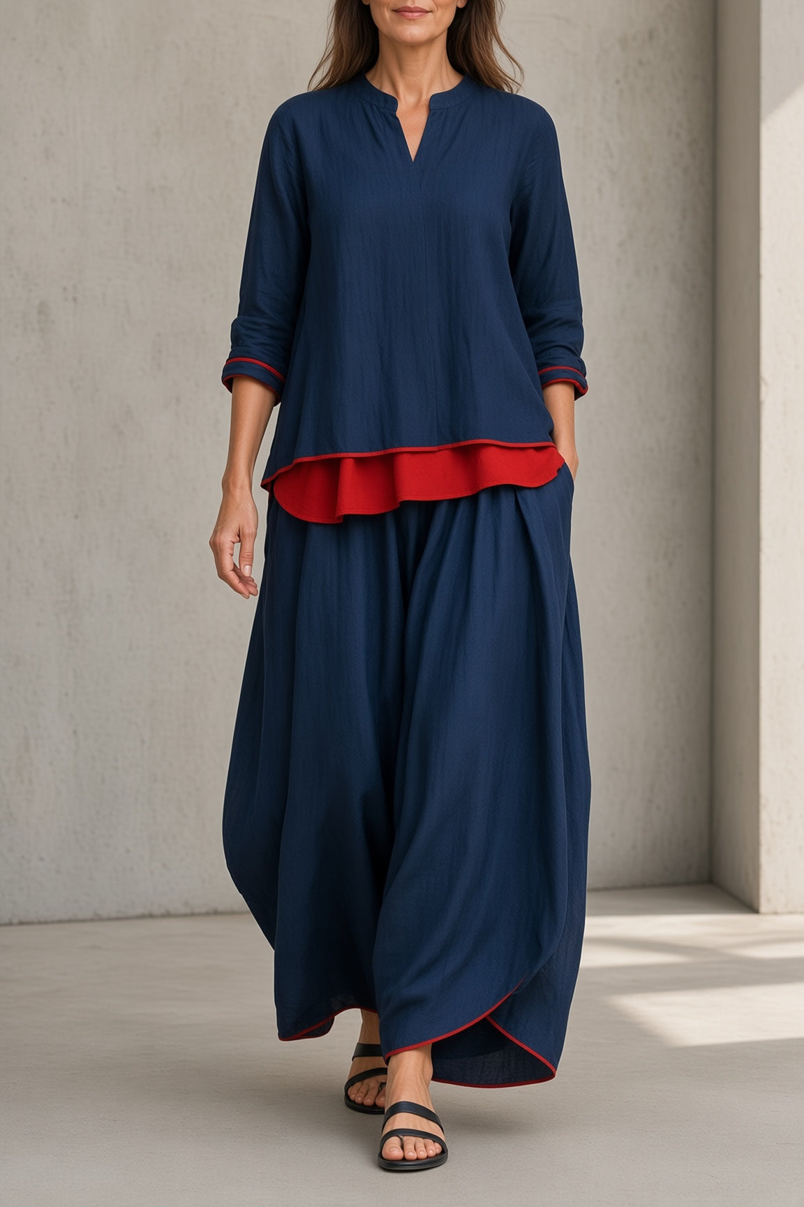 Women's navy blue tunic and wide-leg pants set with red ruffle hem and 3/4 sleeves