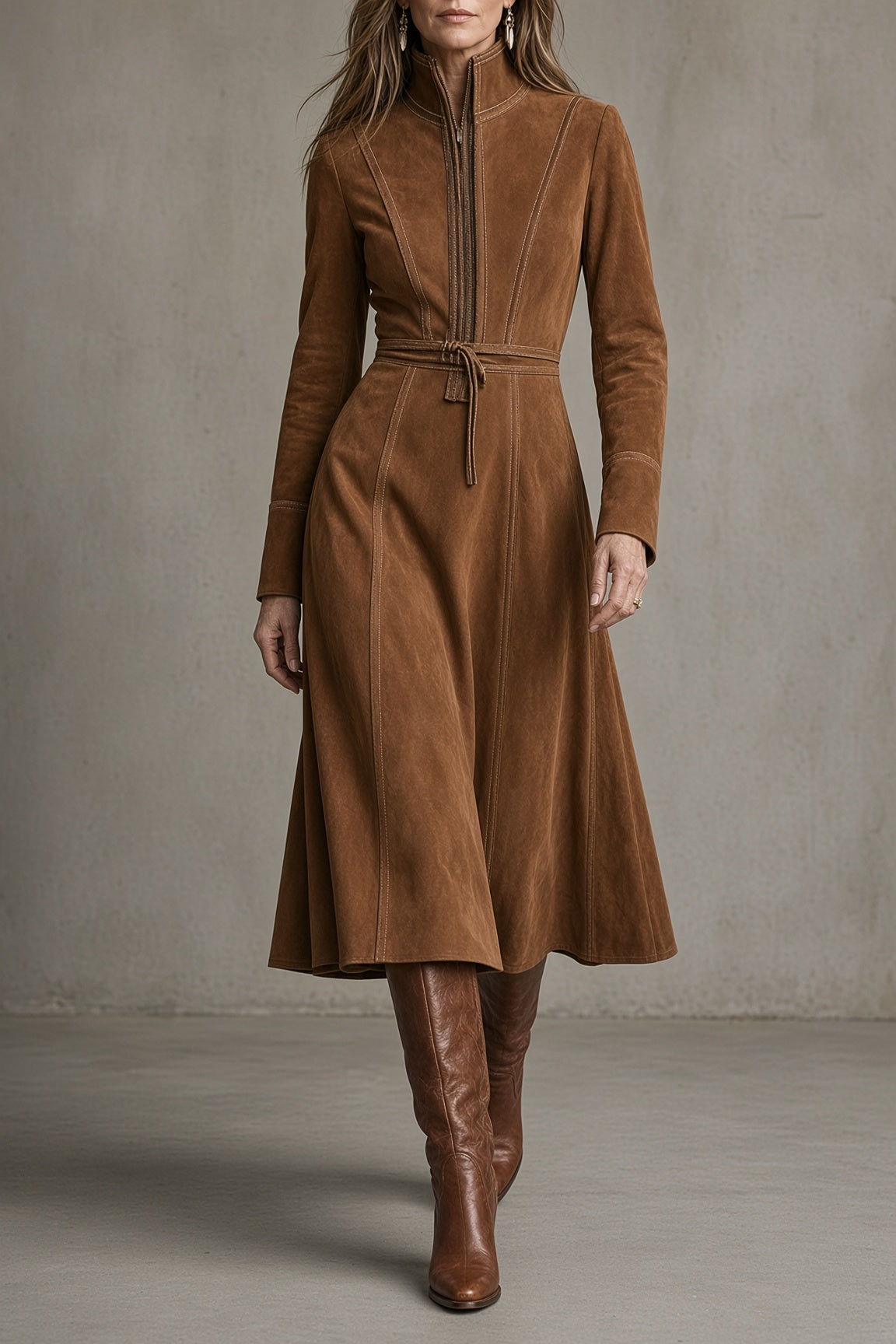Brown suede midi dress with front zipper, stand collar, long sleeves, tie belt