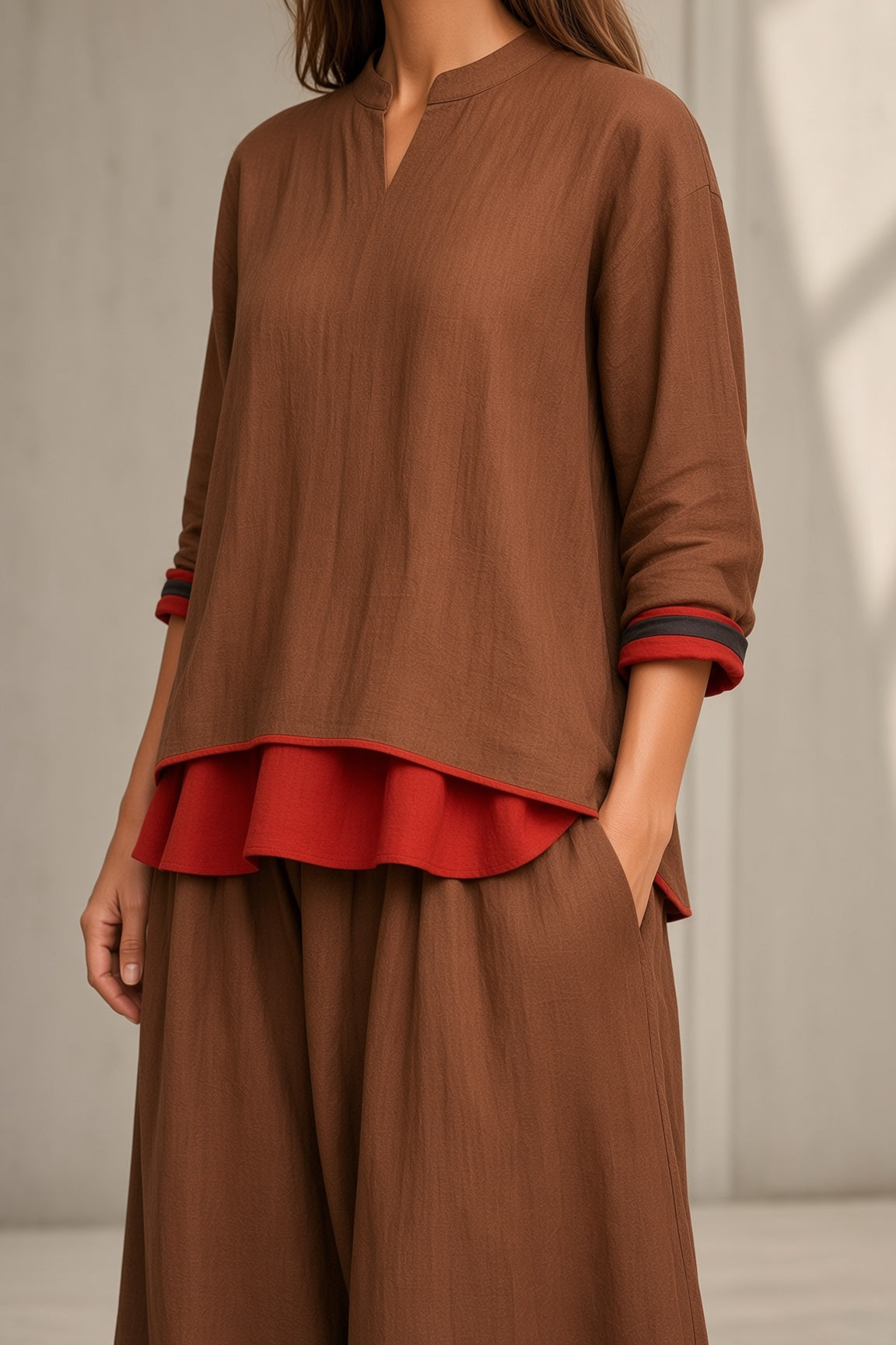 Women's brown tunic and wide-leg pants set with red ruffle hem, 3/4 sleeves, V neckline