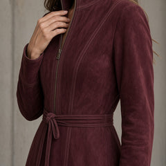 Burgundy suede dress with front zipper, stand collar, long sleeves, tied waist
