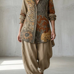 Paisley button-up shirt with beige drawstring pants, long sleeves and curved hem