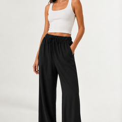 Brennan pants in black, wide-leg flowy style with elastic waistband