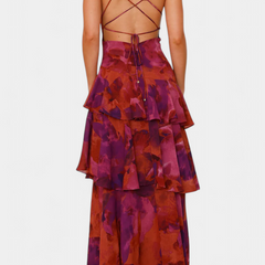Open-back tiered ruffle midi dress with crisscross straps, abstract purple print