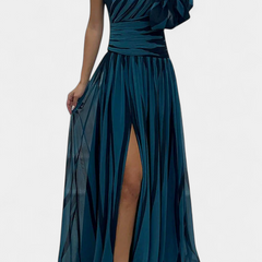 One-shoulder maxi dress in deep teal, gathered waist, ruffle sleeve, side slit.