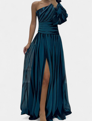 One-shoulder maxi dress in deep teal, gathered waist, ruffle sleeve, side slit.