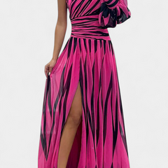 One-shoulder striped maxi dress in pink and dark tones, ruffle sleeve, side slit.
