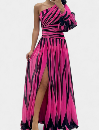 One-shoulder striped maxi dress in pink and dark tones, ruffle sleeve, side slit.