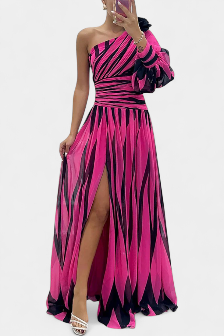 One-shoulder striped maxi dress in pink and dark tones, ruffle sleeve, side slit.