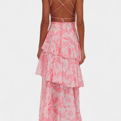 Pink floral midi dress with crisscross back straps and tiered ruffle skirt
