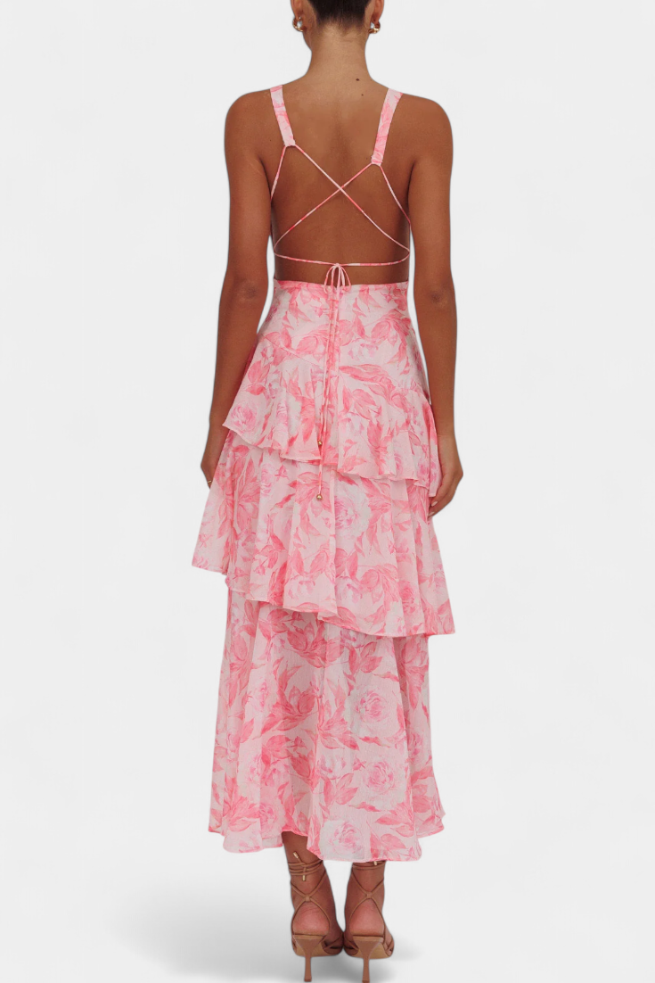 Pink floral midi dress with crisscross back straps and tiered ruffle skirt