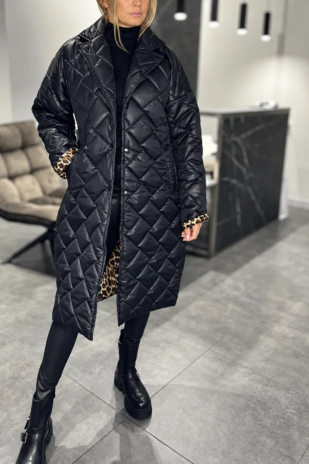 Kendall black quilted coat with leopard-print lining at the cuffs and hem
