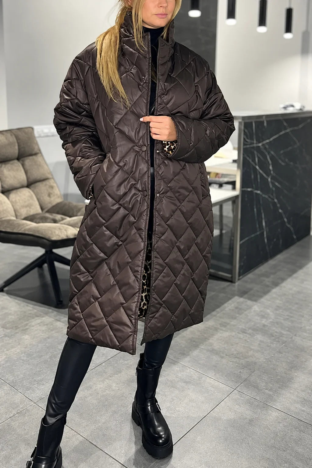 Kendall dark brown quilted coat with leopard-print lining visible at the cuffs and front