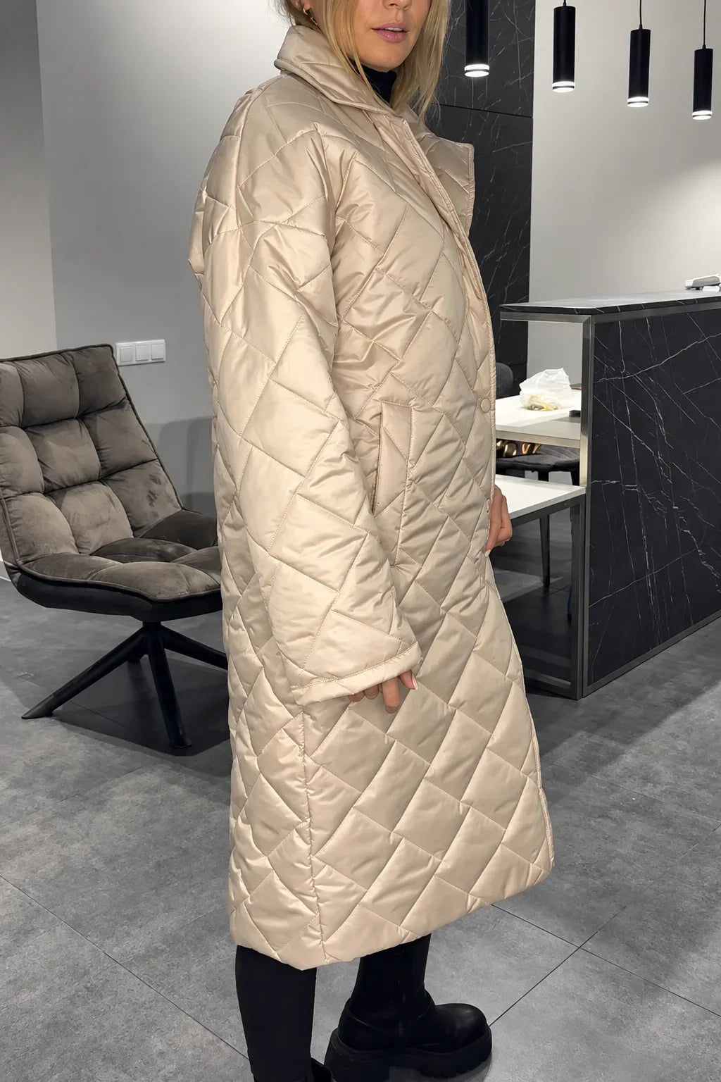 Kendall beige quilted coat shown from the side, with a long diamond-quilted design