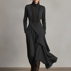 Black asymmetrical maxi knit dress with roll neck and draped wrap front, long sleeves