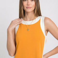 Orange sleeveless tunic dress with white crew neckline and contrast side strip detail