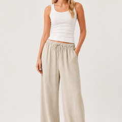 Light beige drawstring waist pants with relaxed wide-leg silhouette