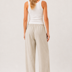 Light beige back view pants with elastic waist and roomy wide legs