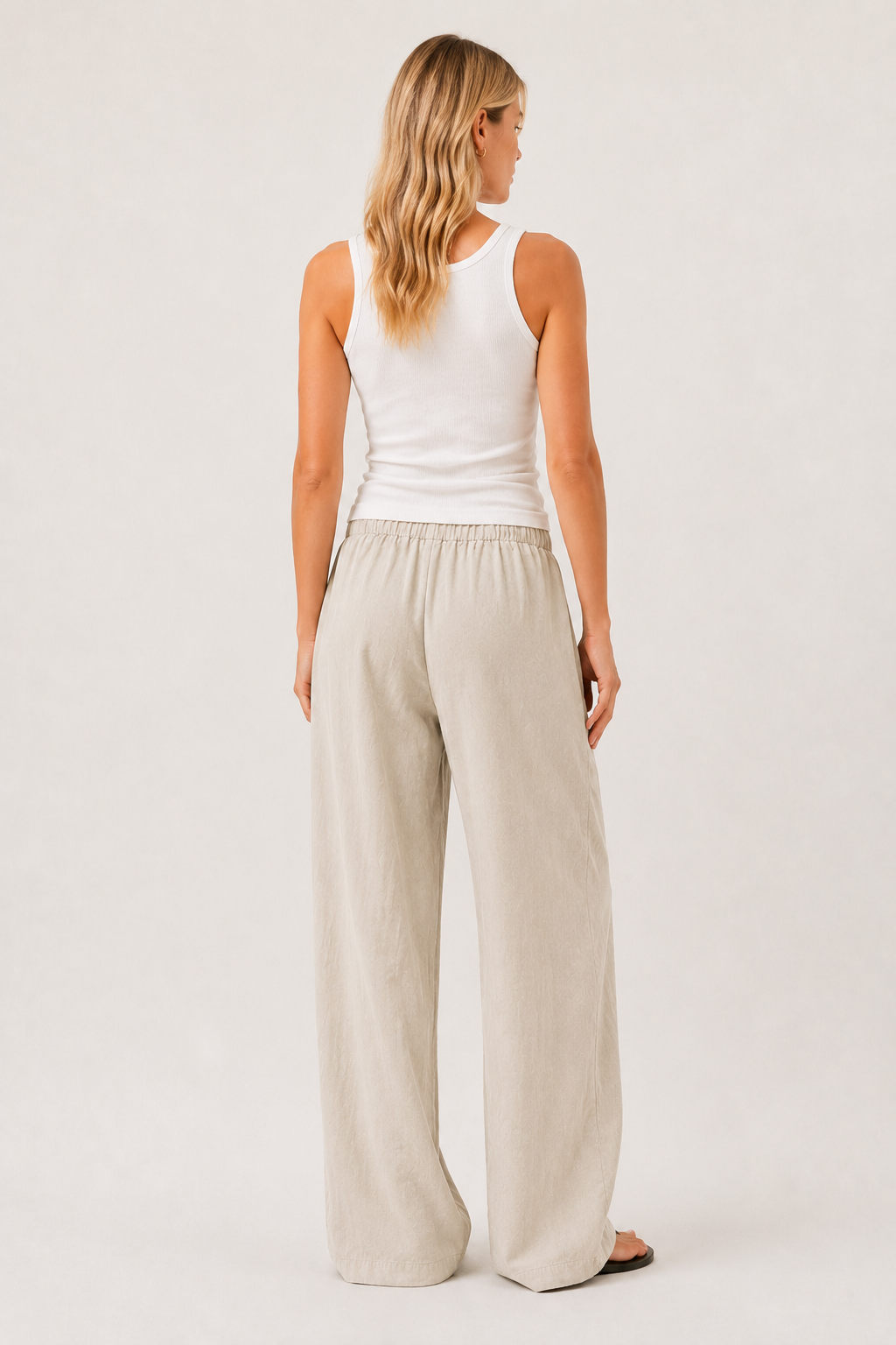 Light beige back view pants with elastic waist and roomy wide legs